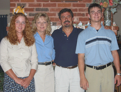 family picture in front of the fireplace